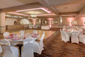 Coral Ballroom styled with pink chairs and lighting